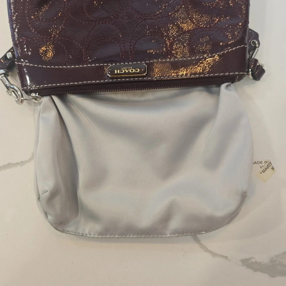 Coach Burgundy Patent Leather Logo Embossed Wristlet Clutch Bag